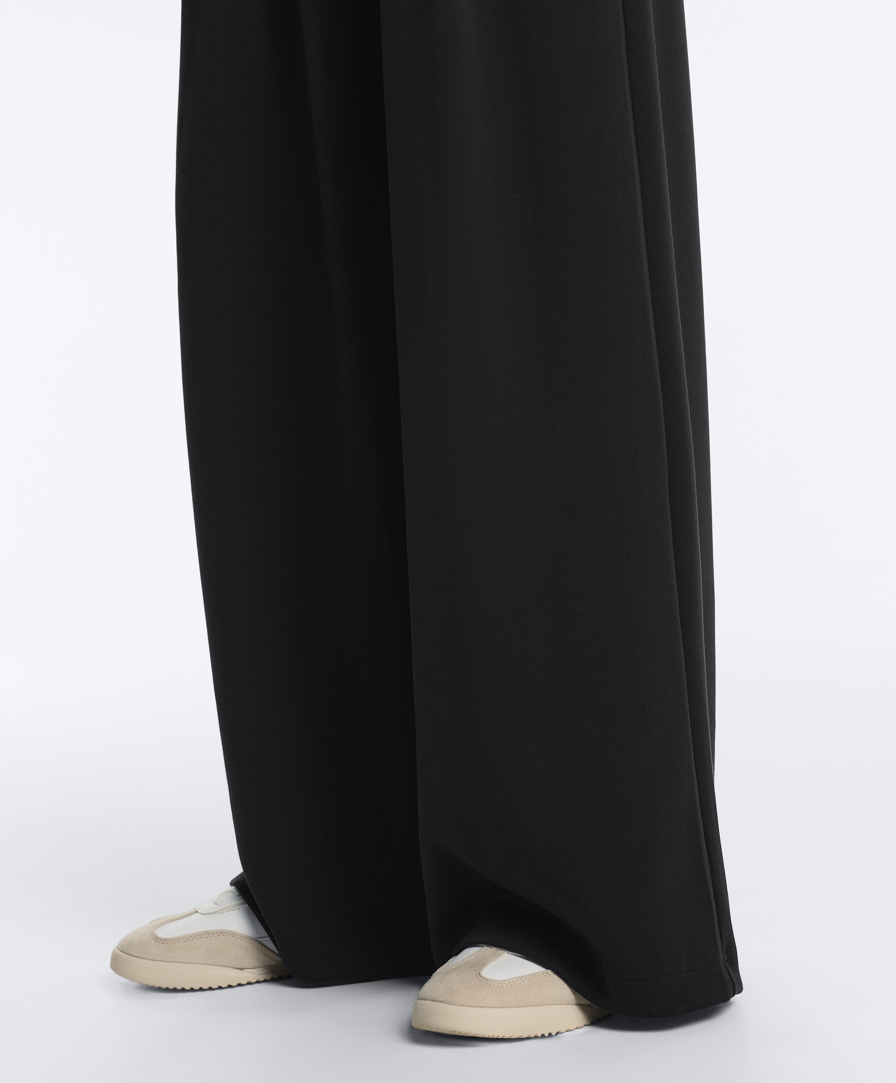 Soft-touch modal wide-leg trousers with pleat waist detail — BLACK