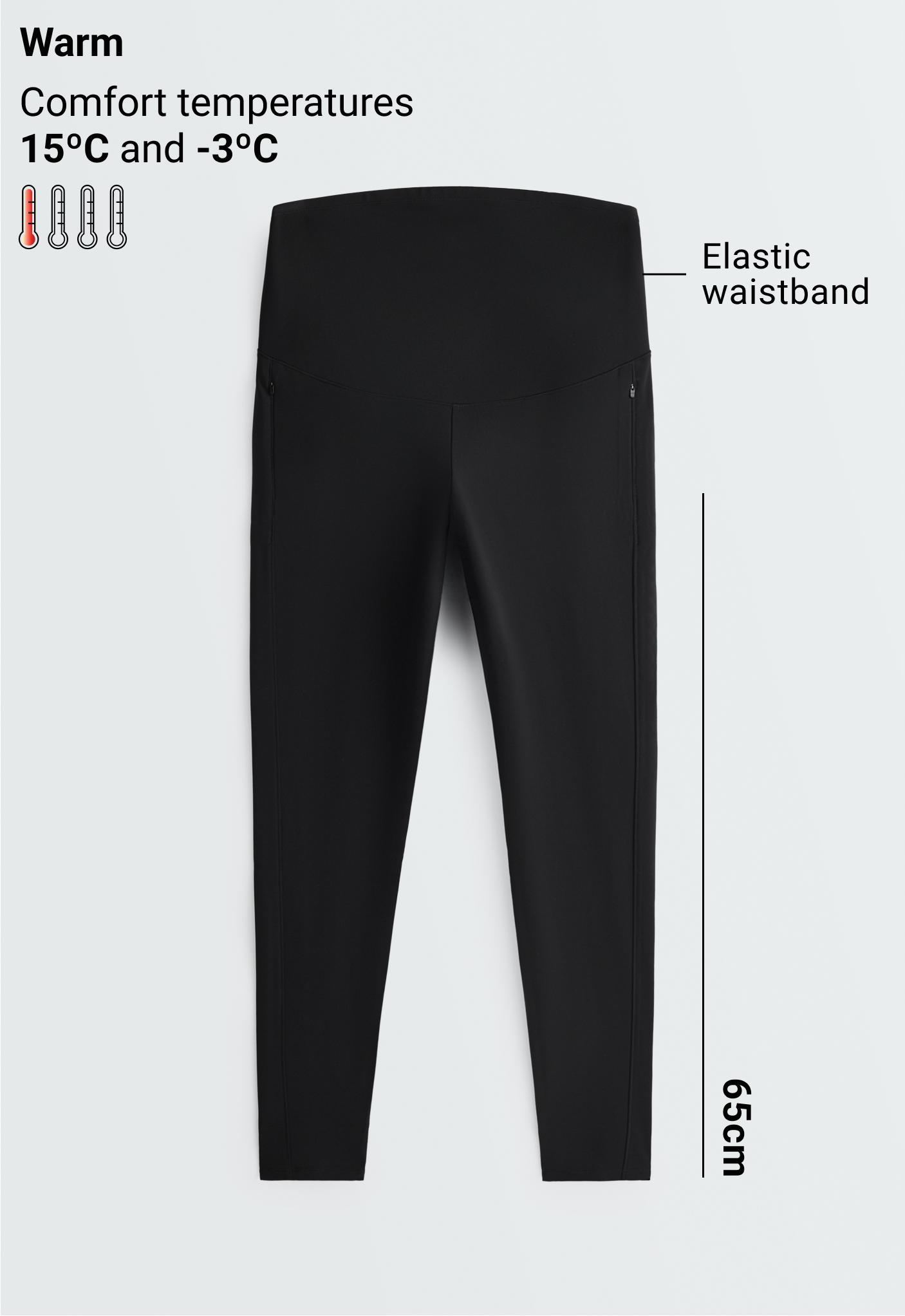 Front view of black leggings with an elastic high waist, front zippered pockets, and side seams.