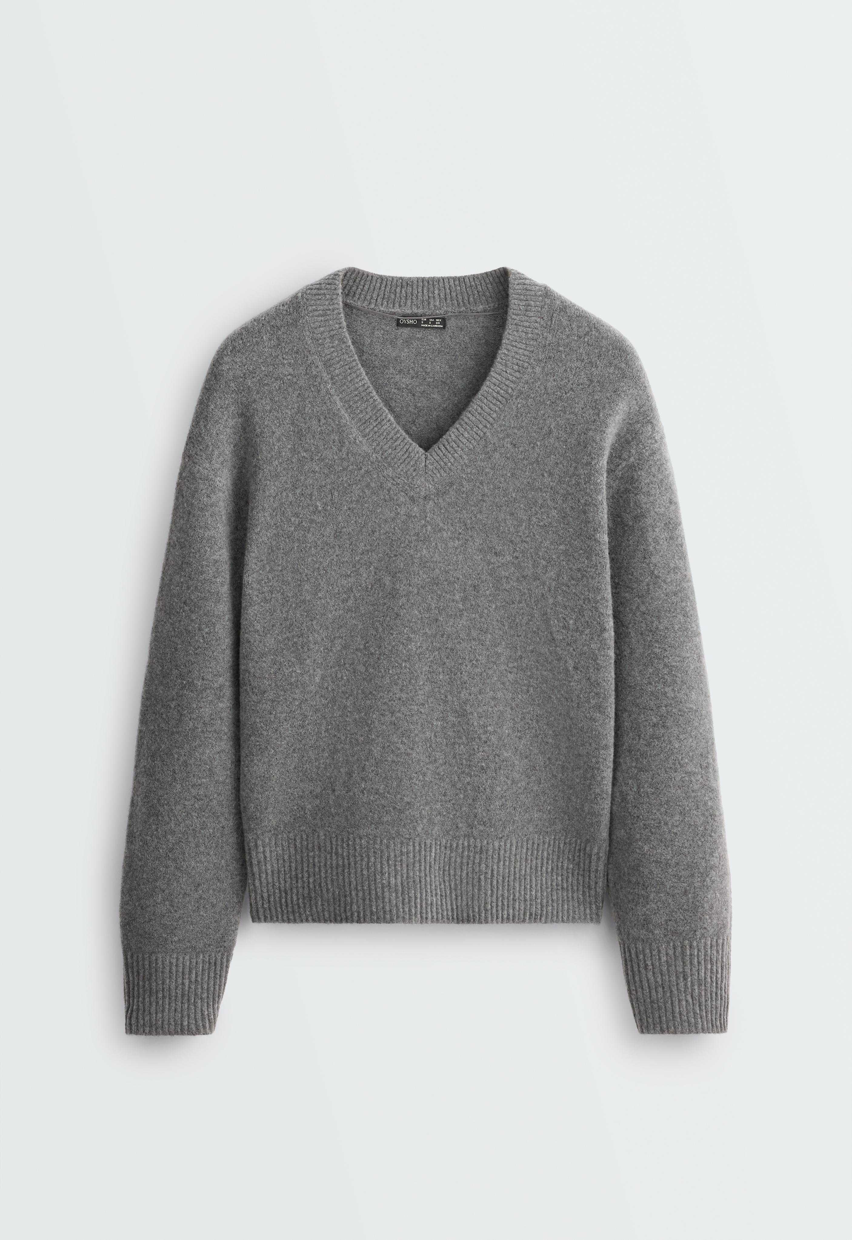 Front view of a heather gray V-neck long-sleeve sweater, featuring ribbed trim on the collar, cuffs, and hem.