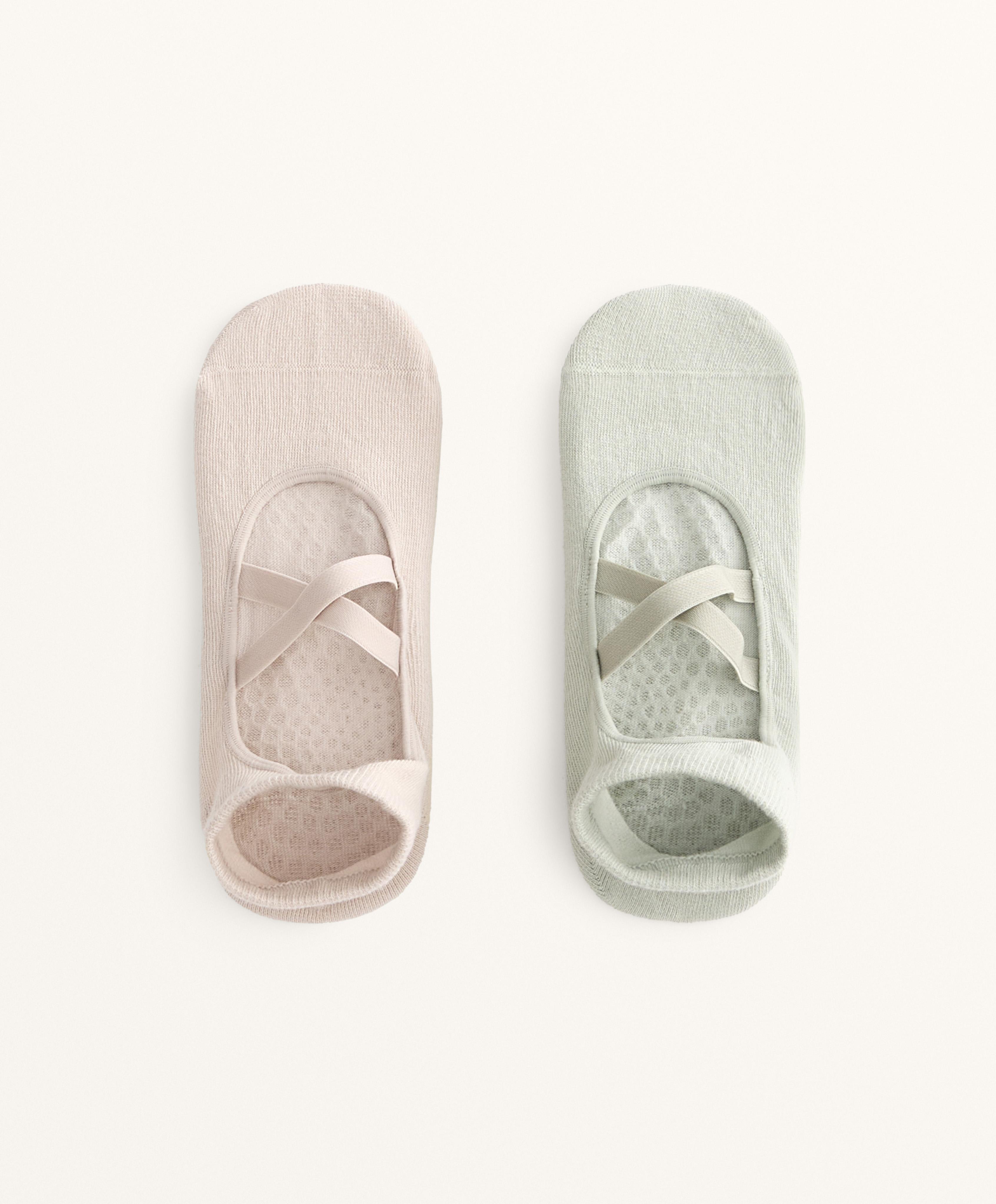 2 pairs of cotton blend yoga and Pilates socks with crossover straps