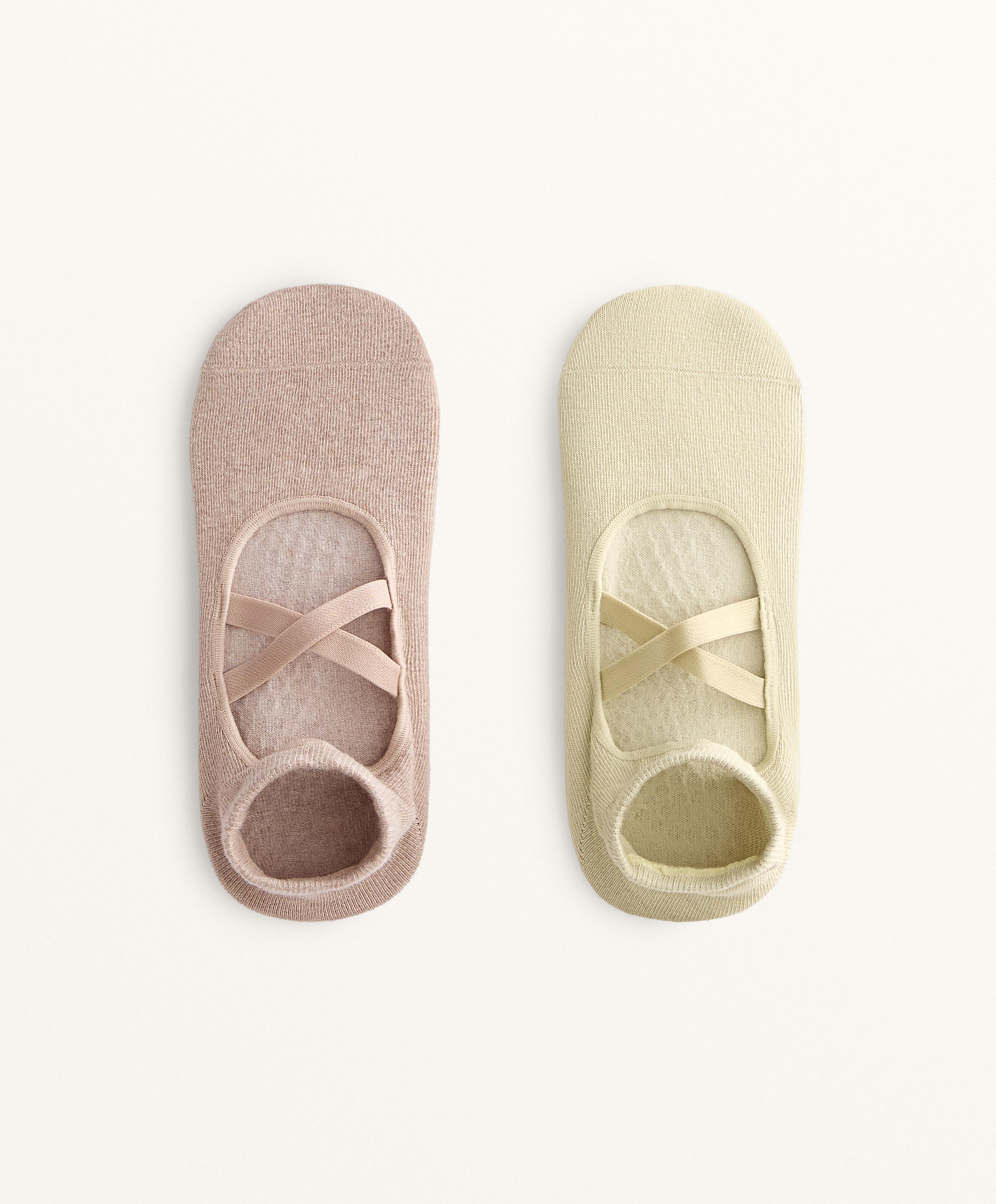 2 pairs of cotton blend yoga and Pilates socks with crossover straps