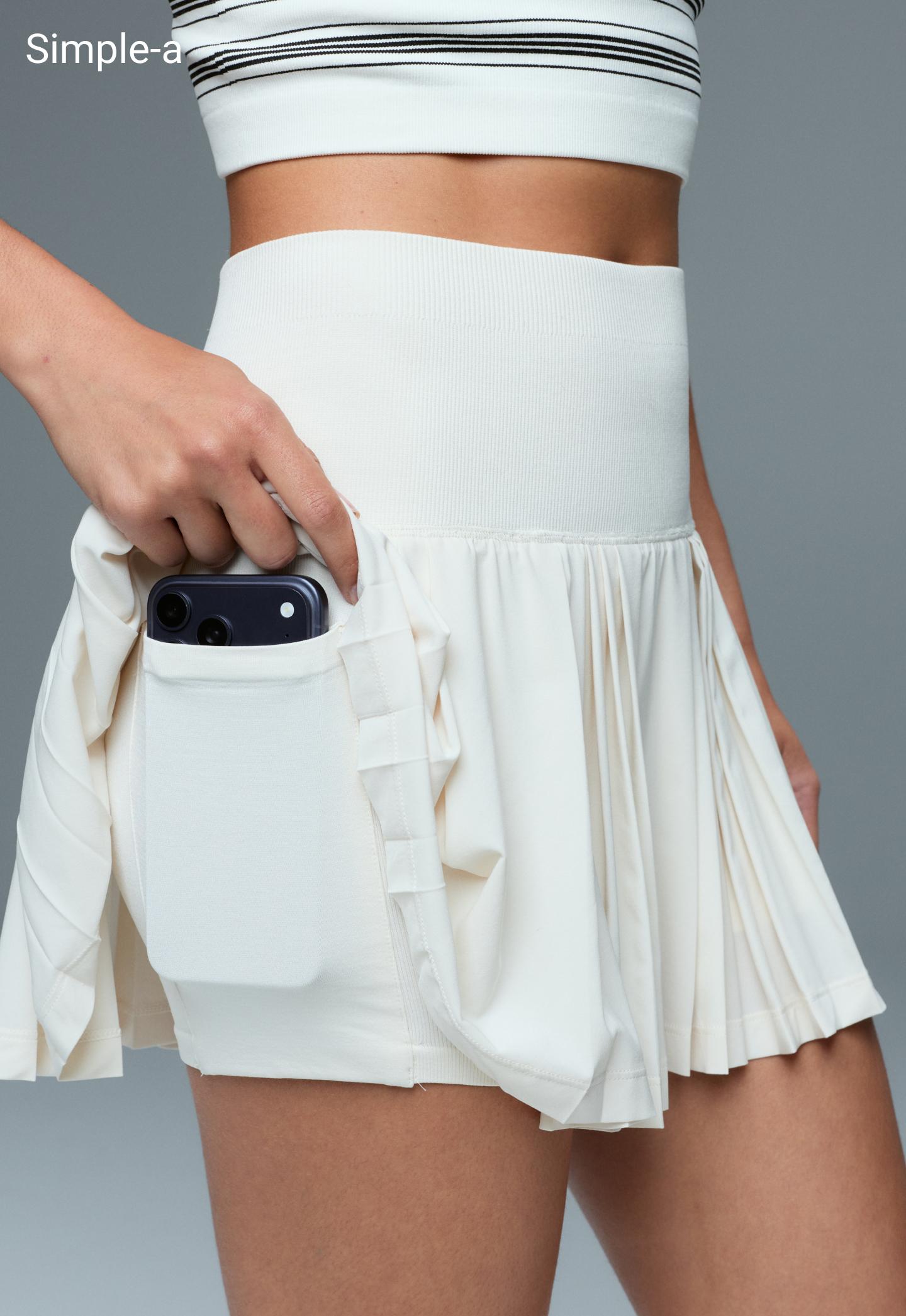 Pleated high-rise seamless short skirt — PALE ECRU