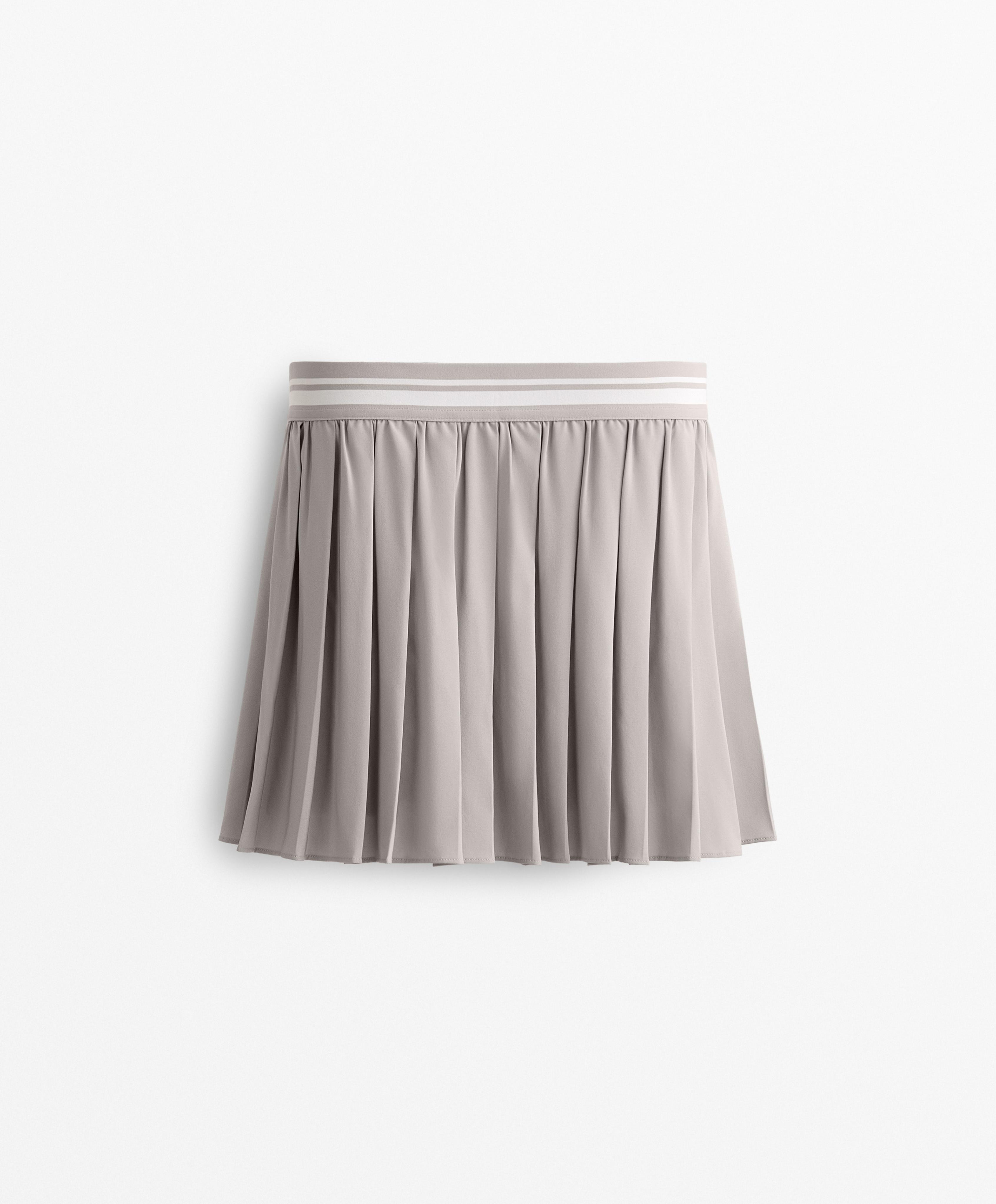 Pleated compressive skirt