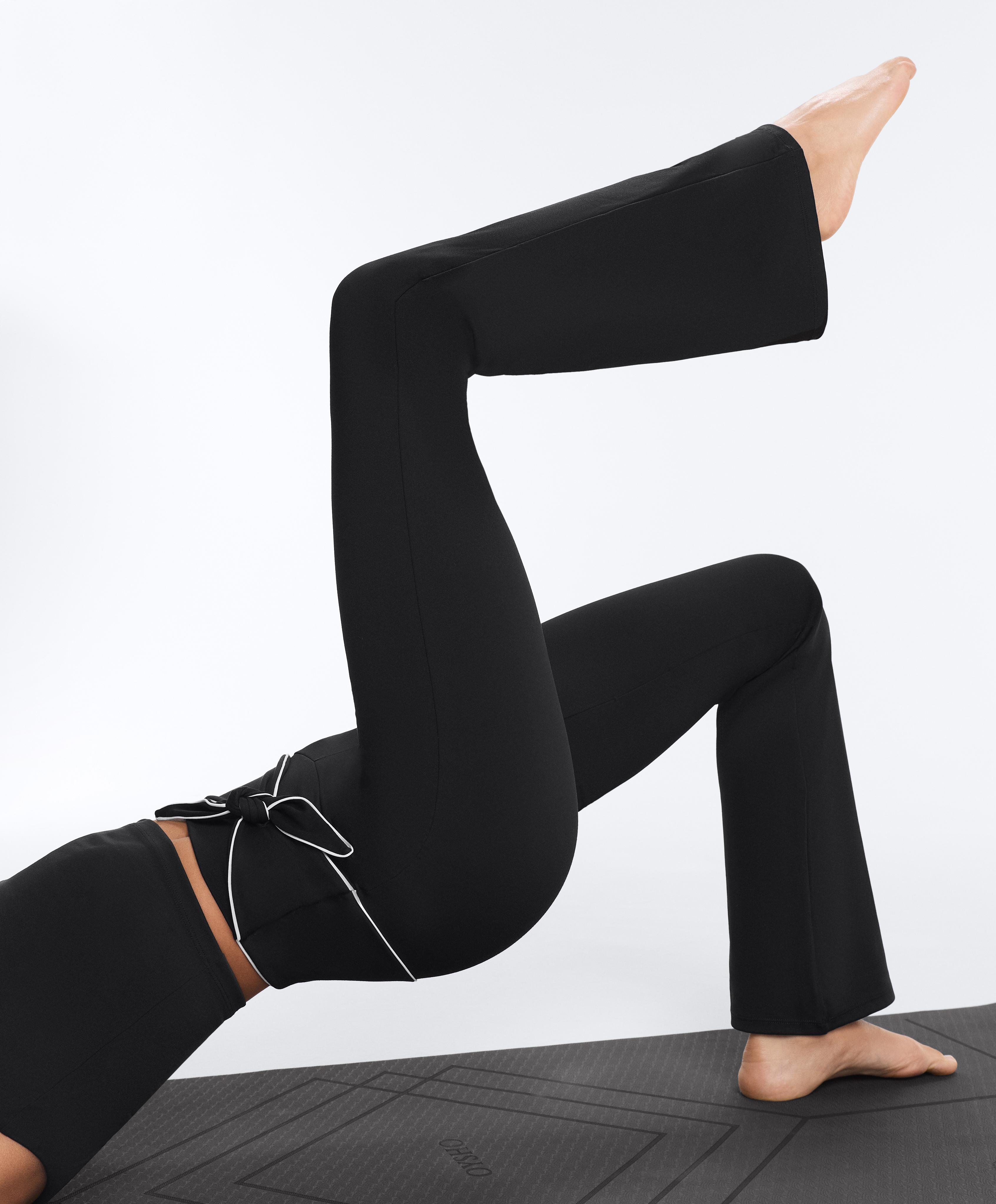 Comfortlux high-rise flare trousers with bow — BLACK